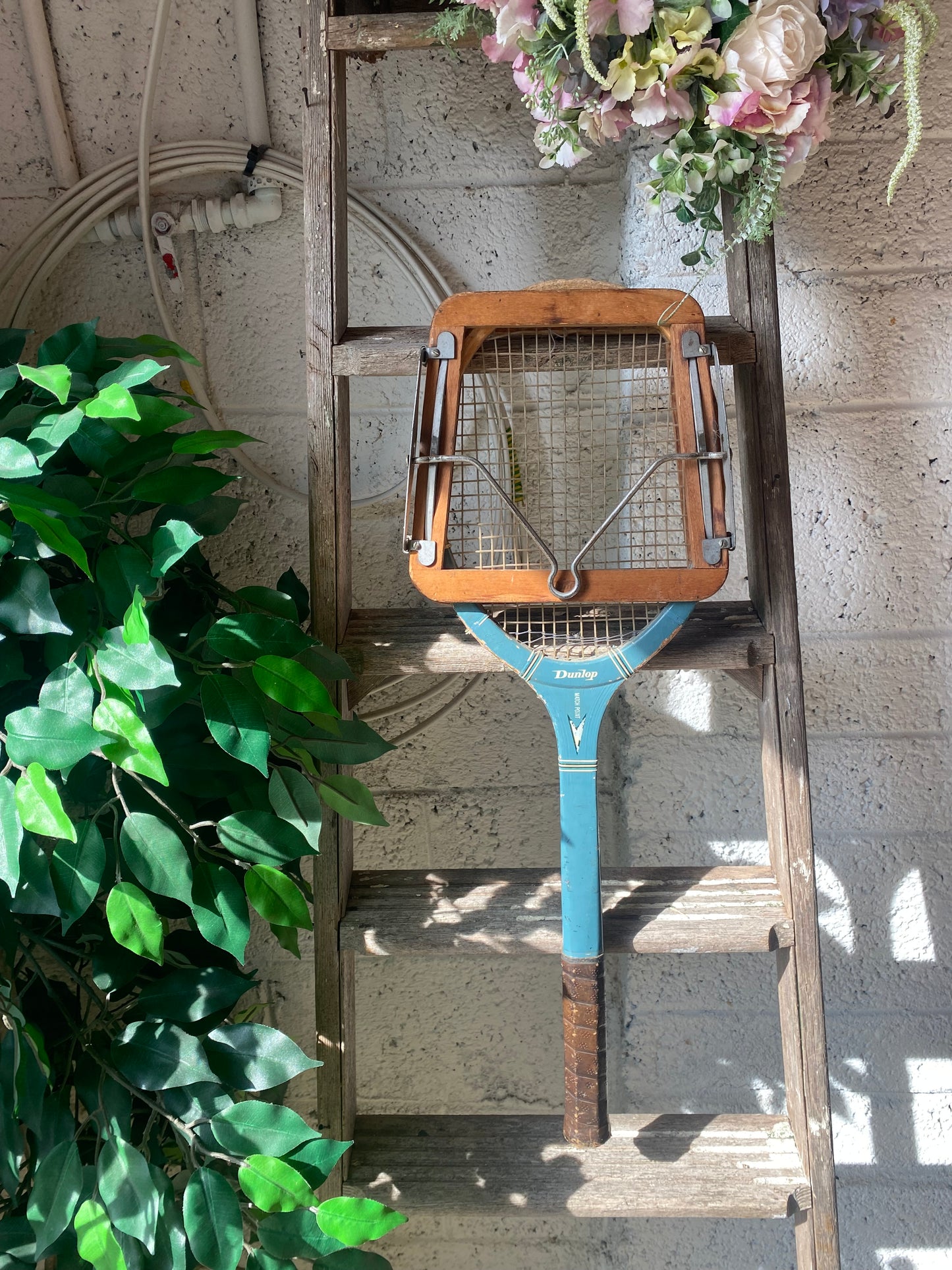 Vintage tennis racket with press