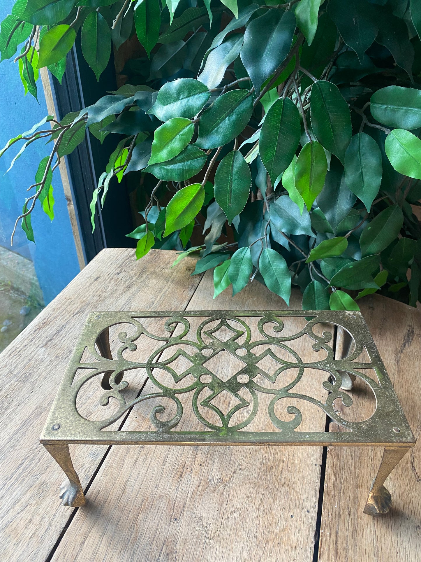 Antique brass trivet