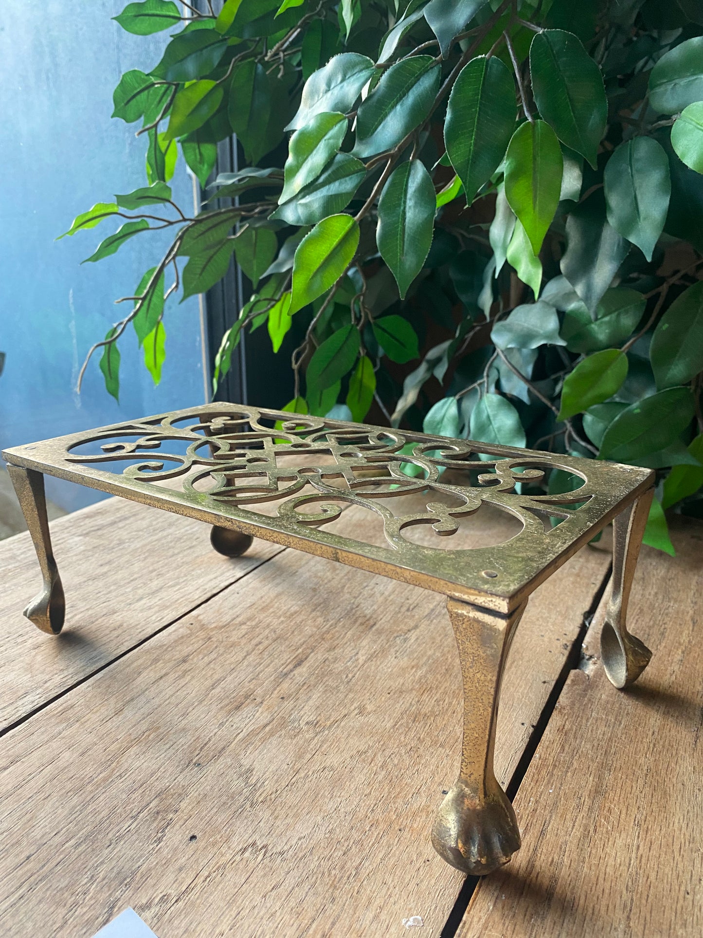 Antique brass trivet