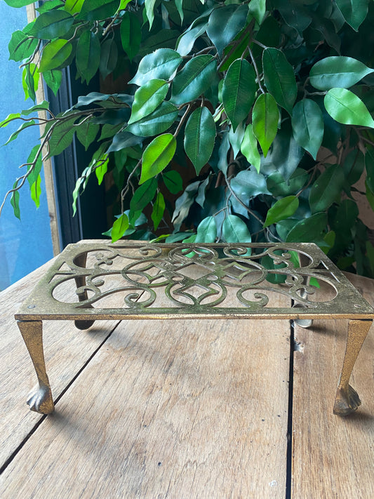 Antique brass trivet
